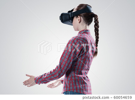 Girl in mask experiencing virtual reality as new entertainment device Girl in mask experiencing virtual reality as new entertainment device 60054659