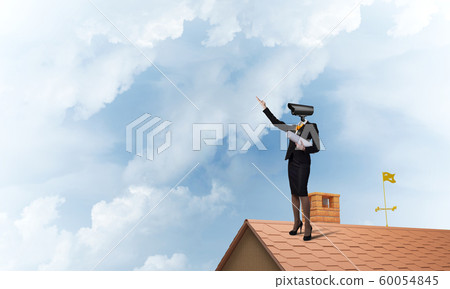 Concept of security and privacy protection with camera headed woman 60054845