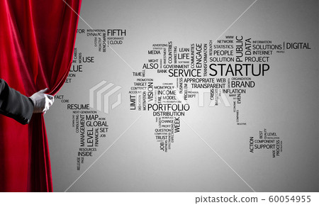 World map behind drapery curtain and hand opening it World map behind drapery curtain and hand opening it 60054955