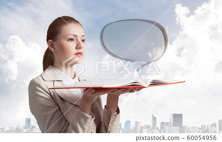 Woman looks at transparent speech bubble 60054956