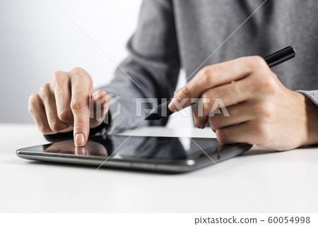 Woman using digital tablet computer 60054998