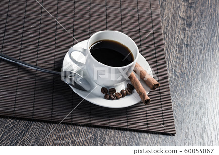 Cup of espresso coffee on wooden table Cup of espresso coffee on wooden table 60055067