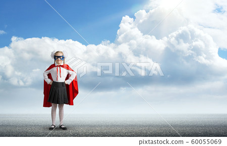 Girl power concept with cute kid guardian against cloudscape background . Mixed media Girl power concept with cute kid guardian against cloudscape background . Mixed media 60055069