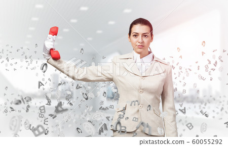 Woman keep at distance vintage red phone 60055292