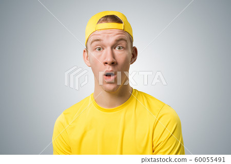 Stupefied teenager with mouth opened Stupefied teenager with mouth opened 60055491