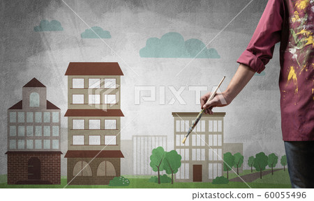 Close up artist hand holding paintbrush 60055496