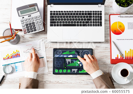 Businessman working at financial reports Businessman working at financial reports 60055575