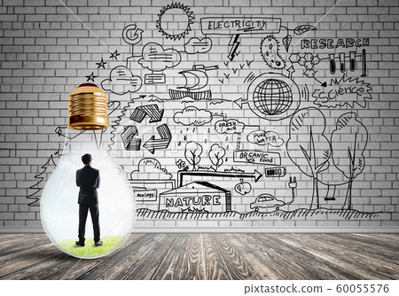Businessman trapped in bulb Businessman trapped in bulb 60055576