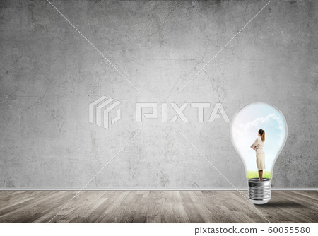 Businesswoman trapped in bulb Businesswoman trapped in bulb 60055580