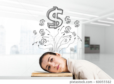 Business woman lying on desk with open book Business woman lying on desk with open book 60055582