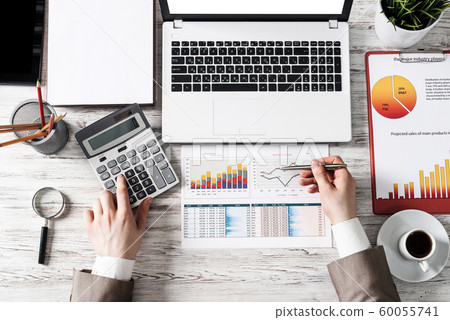 Businessman working at office desk 60055741