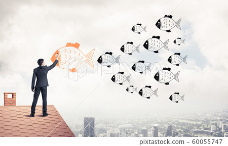 Businessman standing with back on house brick roof and drawing. Businessman standing with back on house brick roof and drawing. 60055747