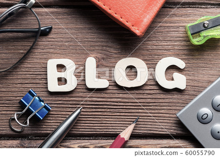 Blog word on wooden table and office stationary around 60055790