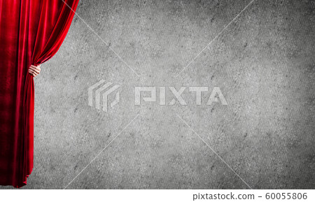 Concrete wall behind drapery curtain and hand opening it Concrete wall behind drapery curtain and hand opening it 60055806