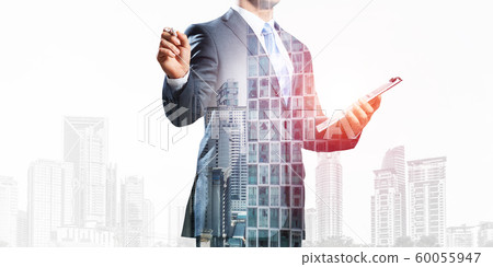 Standing entrepreneur in business suit Standing entrepreneur in business suit 60055947
