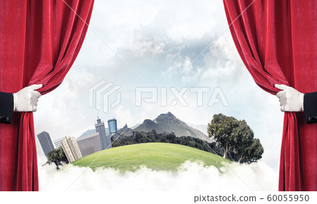 Modern cityscape behind drapery curtain and hand opening it Modern cityscape behind drapery curtain and hand opening it 60055950