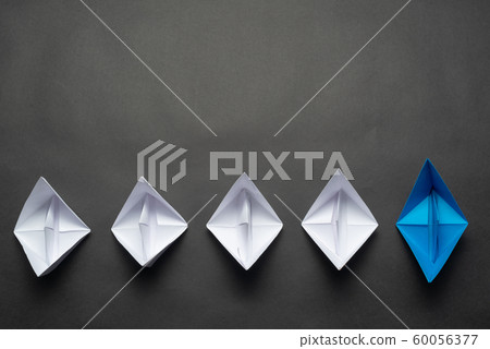 Row of paper ships on black background Row of paper ships on black background 60056377