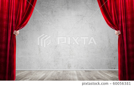 Concrete wall behind drapery curtain and hand opening it Concrete wall behind drapery curtain and hand opening it 60056381