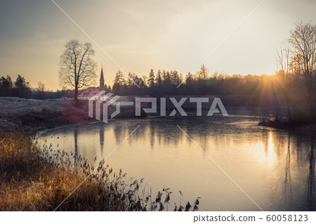 Evening sunny landscape with an ancient castle Evening sunny landscape with an ancient castle 60058123