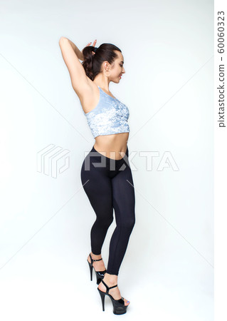 Sexy dancer in black leggings with high heels on 60060323