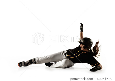 Baseball player, pitcher in a black uniform practicing on a white background. 60061680