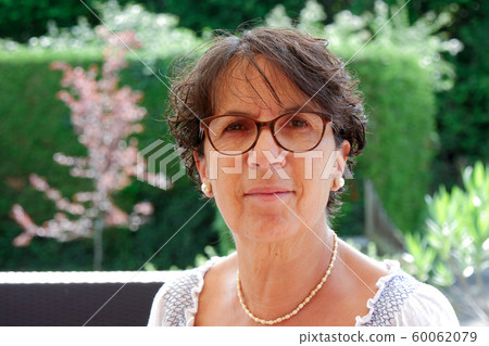 Portrait of a middle-aged brunette woman Portrait of a middle-aged brunette woman 60062079