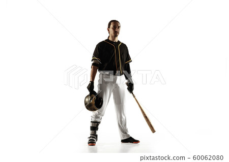 Baseball player, pitcher in a black uniform practicing on a white background. 60062080