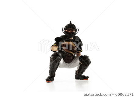 Baseball player, pitcher in a black uniform practicing on a white background. Baseball player, pitcher in a black uniform practicing on a white background. 60062171