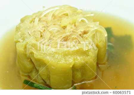 boiled bitter melon stuffed minced pork and glass noodles soup on bowl 60063571