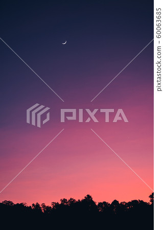 Crescent moon and beautiful sky in the evening Crescent moon and beautiful sky in the evening 60063685