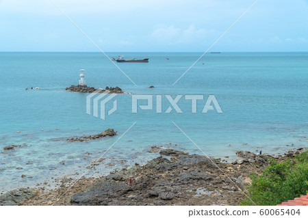 cargo boats moored near the lighthouse cargo boats moored near the lighthouse 60065404