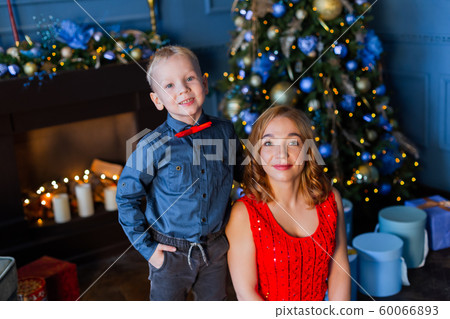 Happy boy with mom in New Year's decor. Happy boy with mom in New Year's decor. 60066893