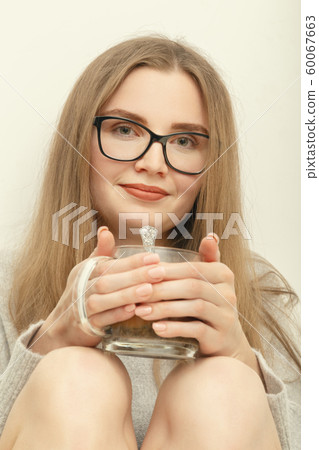 woman with tea mug woman with tea mug 60067663