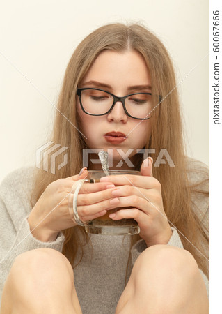 woman with tea mug woman with tea mug 60067666