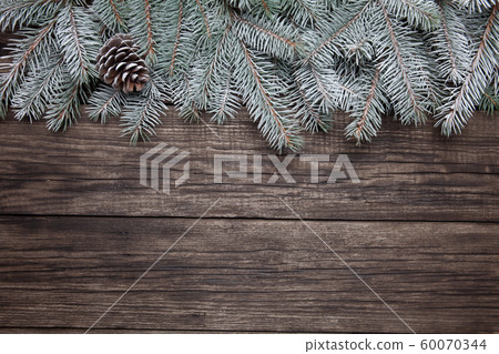 Christmas fir tree with decoration on dark wooden background 60070344