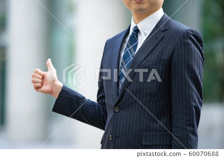 Businessman posing for "thumb up" Businessman posing for "thumb up" 60070688