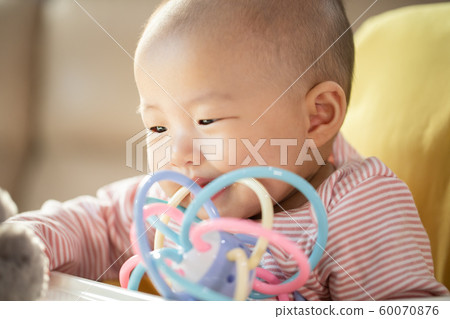 Asian baby happy in the room.Asian baby girl lying 60070876