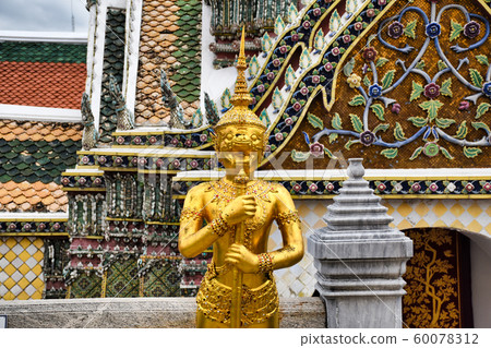 Beautifully stunning gold statue of a Kinnara, a Beautifully stunning gold statue of a Kinnara, a 60078312