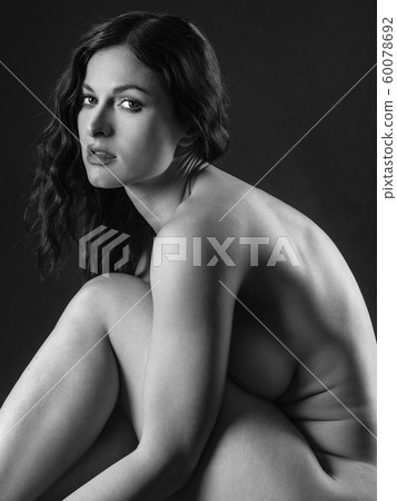 Nude woman sitting and posing 60078692