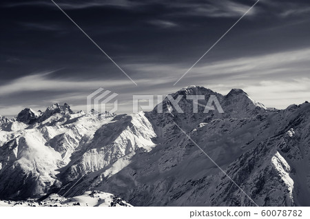 High snowy mountains at winter evening 60078782
