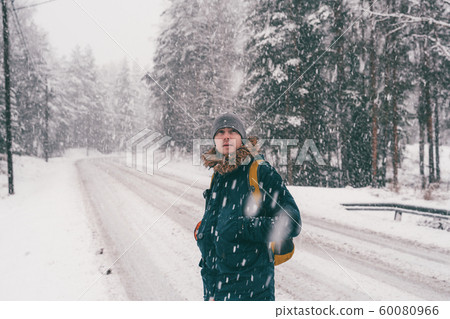 Photo of man for walk in winter forest Photo of man for walk in winter forest 60080966