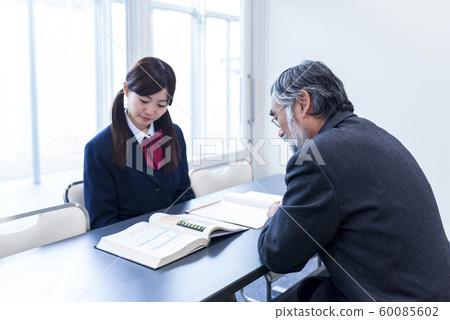 Studying for an entrance exam High school girl and teacher Studying for an entrance exam High school girl and teacher 60085602