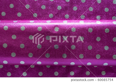 Purple shiny wrapping paper with polka dots with a Purple shiny wrapping paper with polka dots with a 60085754