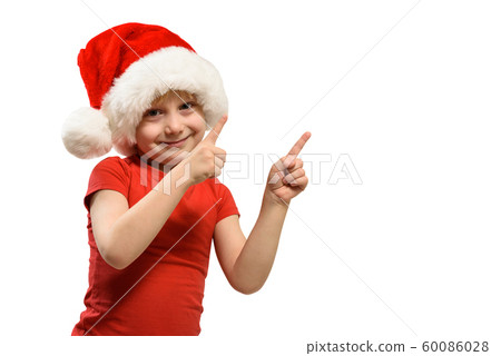 Blond boy in Santa hat points his fingers. Isolate Blond boy in Santa hat points his fingers. Isolate 60086028