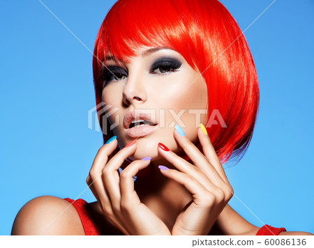 Portrait  of a model with red hairs and multicolor 60086136