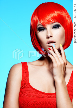 Portrait  of a model with red hairs and multicolor 60086141
