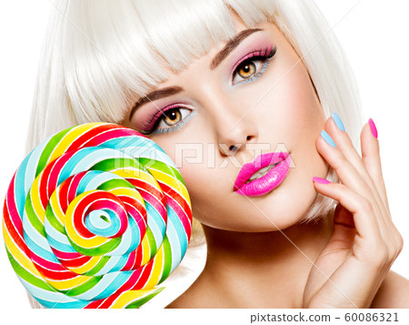 Face of a beautiful  girl with pink eye make-up 60086321