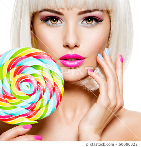 Face of a beautiful  girl with pink eye make-up 60086322