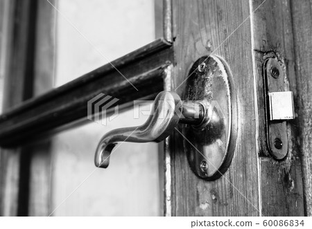 Old vintage door handle closeup Old vintage door handle closeup 60086834