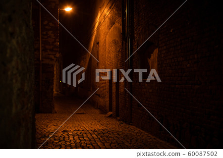 lamp lighting in the narrow streets of night city 60087502